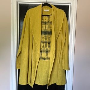 Bryn Walker yellow open front jacket and tie dyed yellow and black tank.